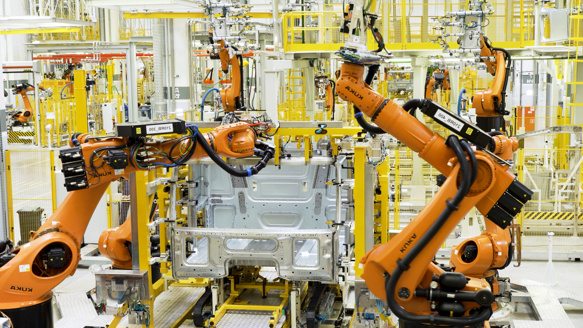 Manufacturing floor with industrial robotic arms